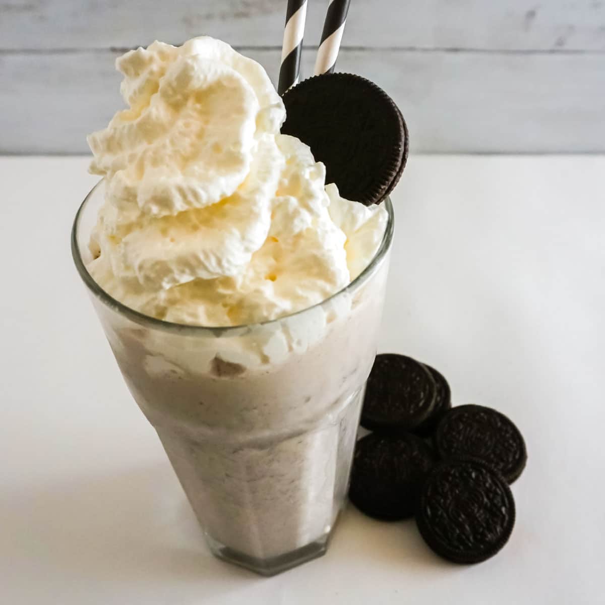 Top angle of Oreo Milkshake, Oreos on table.