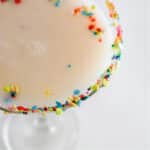 Top view of Sugar Cookie Cocktail with colorful sprinkles on rim.