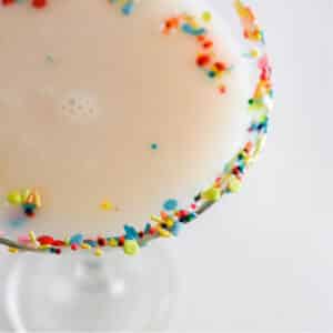 Top view of Sugar Cookie Cocktail with colorful sprinkles on rim.