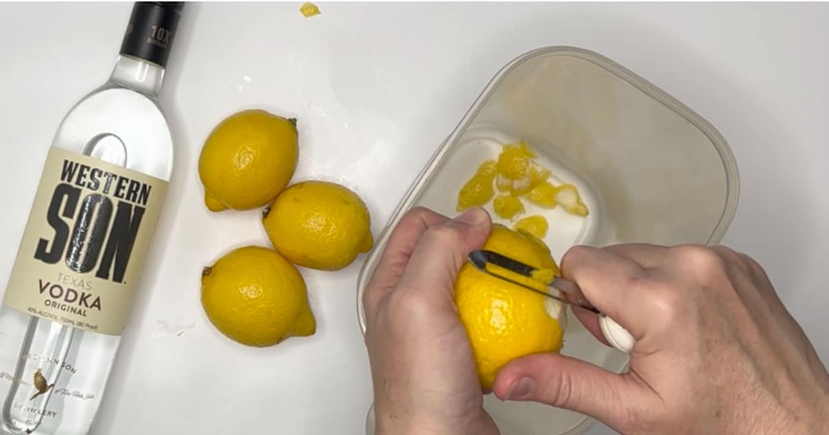 lemons being peeled to make limoncello