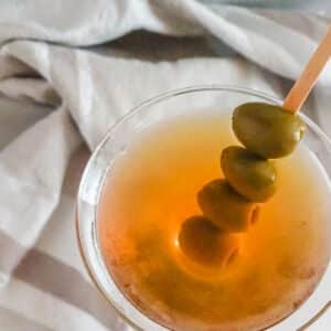 overhead view of a martini with olives