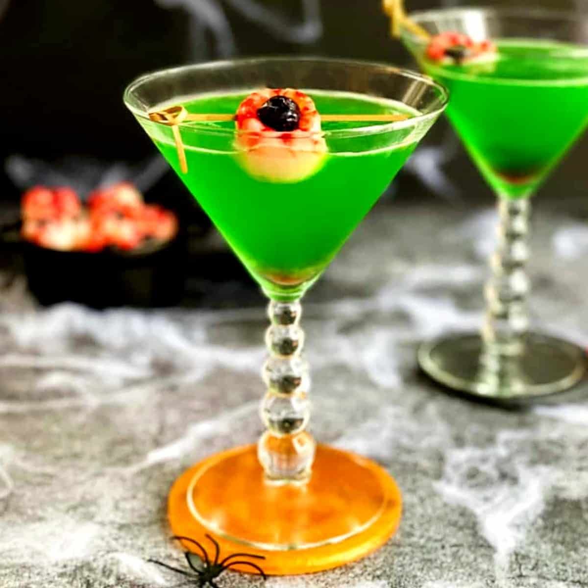 Green Halloween Lychee Gin Cocktail | Lychee Eyeballs | EmilyFabulous